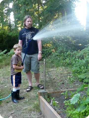 Cody watering the garden